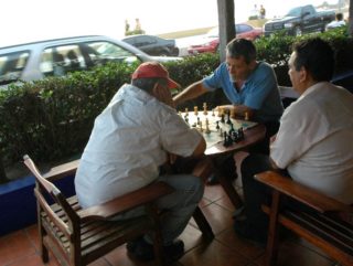 group of people playing chess 