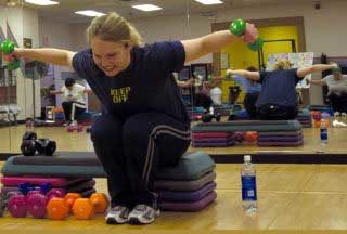 Woman in gym doing exercise